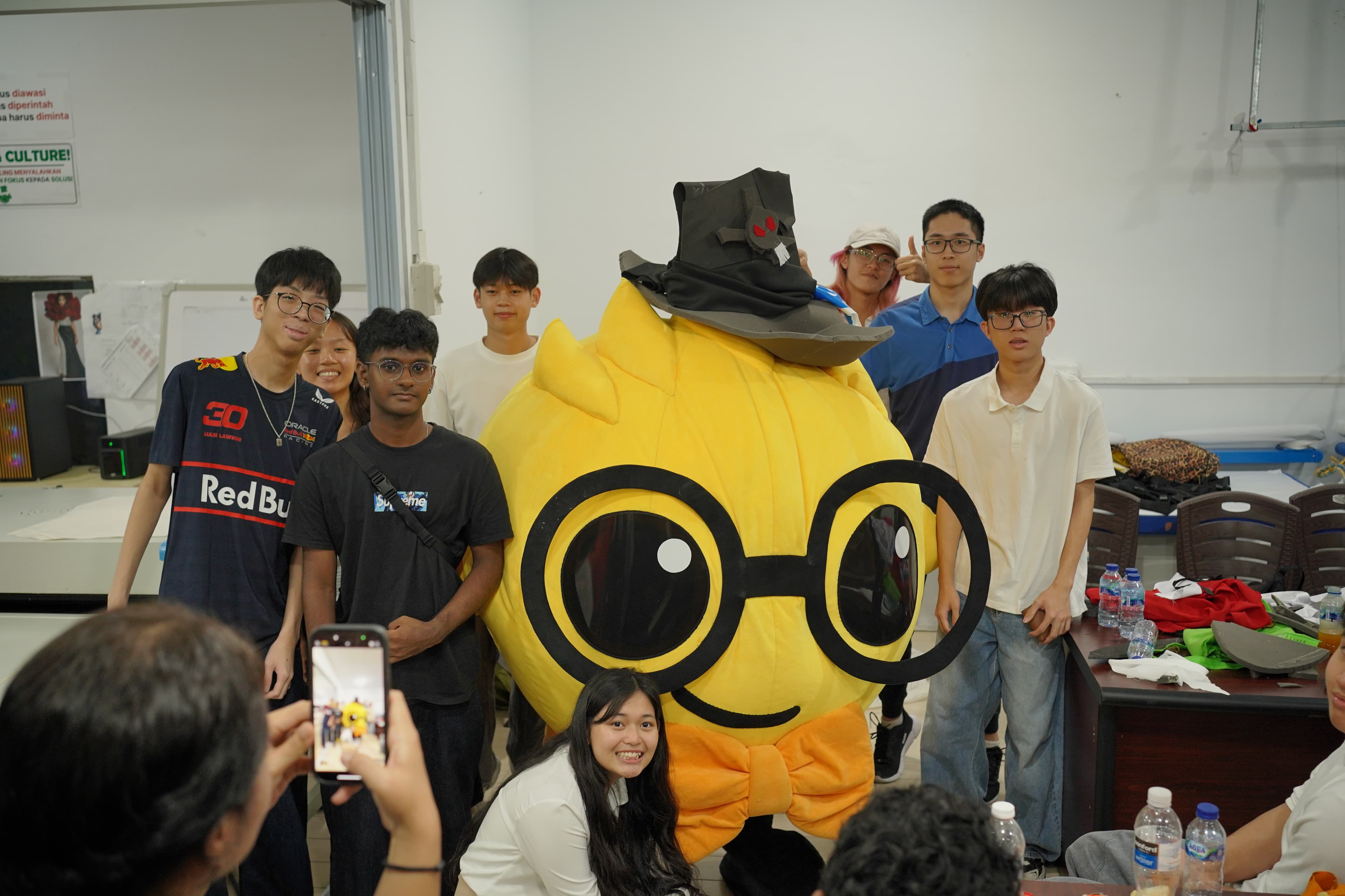 Students learning about mascot design iterations